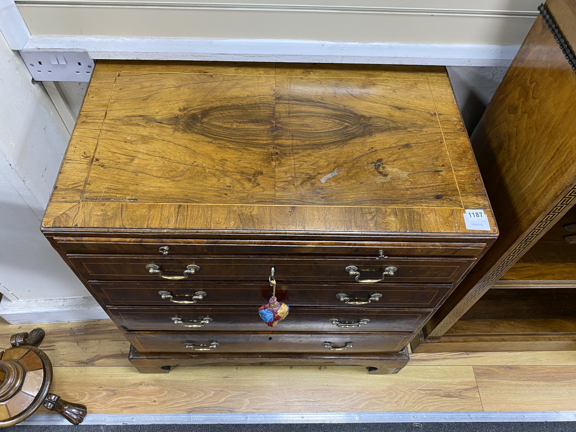 A small 18th century banded walnut four drawer chest with brushing slide, width 78cm, depth 46cm, height 82cm